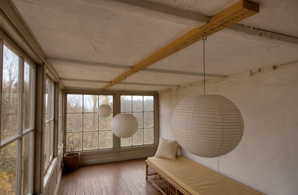 Hanging lantern suspended from a ceiling above a furnished room